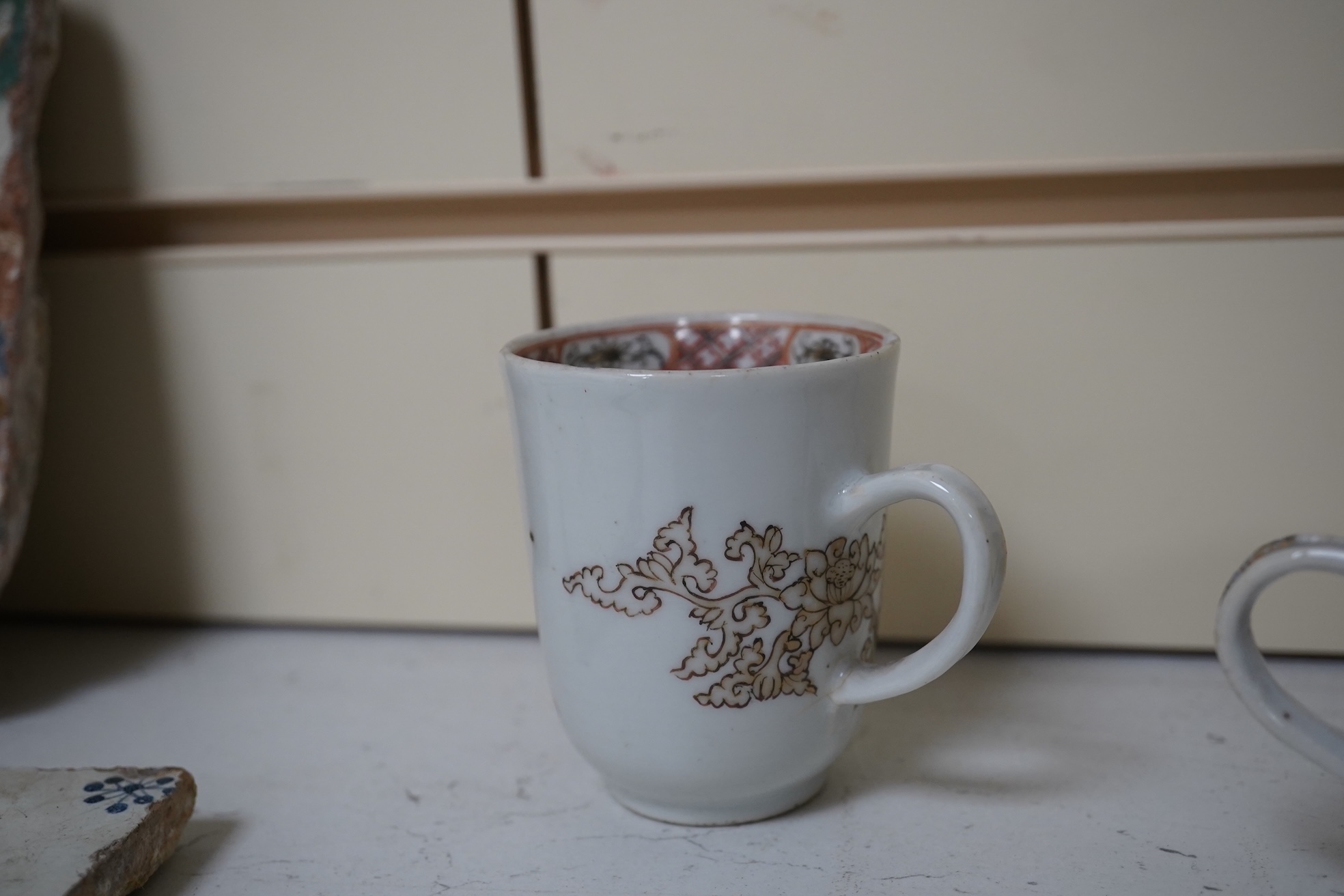 Six assorted 18th century Chinese export coffee cups with armorial decoration, and a similar European subject cup and saucer. Condition - damaged/restored